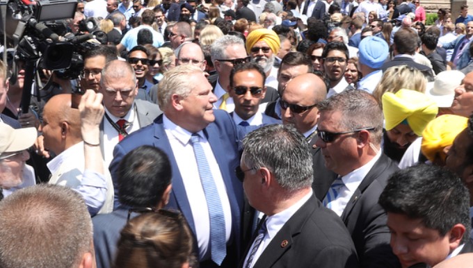 Doug Ford walks the crowd at his swearing in ceremony.