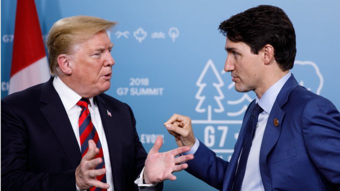 Donald Trump and Justin Trudeau speak together at the G7.