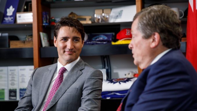 Prime Minister Justin Trudeau speaks to Toronto Mayor John Tory.