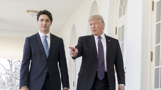 Justin Trudeau walks with Donald Trump at the White House.